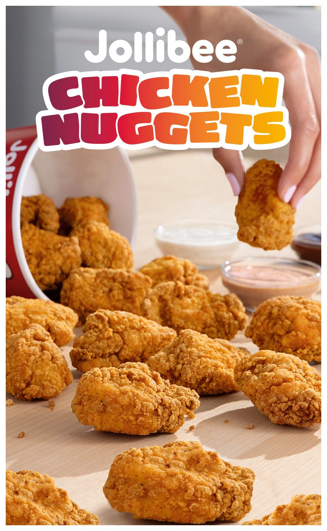 Chicken nuggets pieces and one being held by a hand with 'Jollibee Chicken Nuggets' text.
